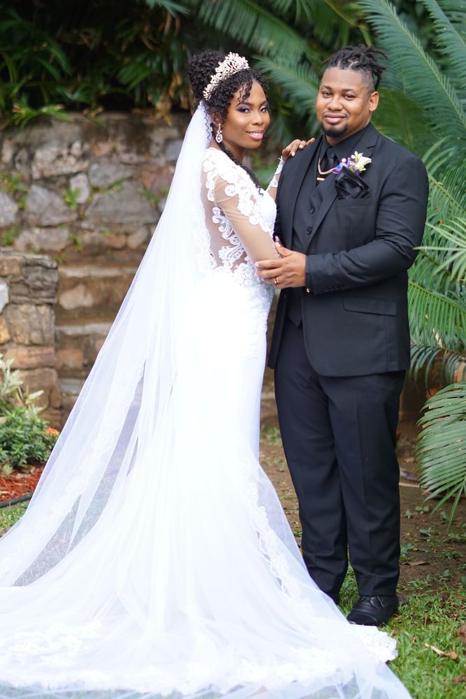 Bride and groom portrait in a lush garden
