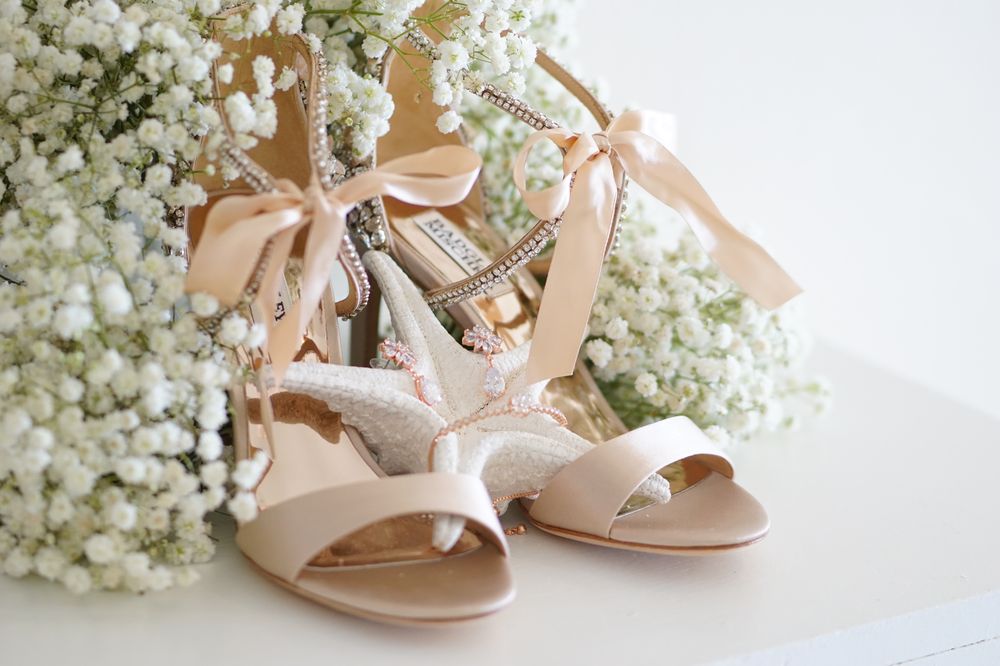 Bridal shoes styled with baby's breath flowers