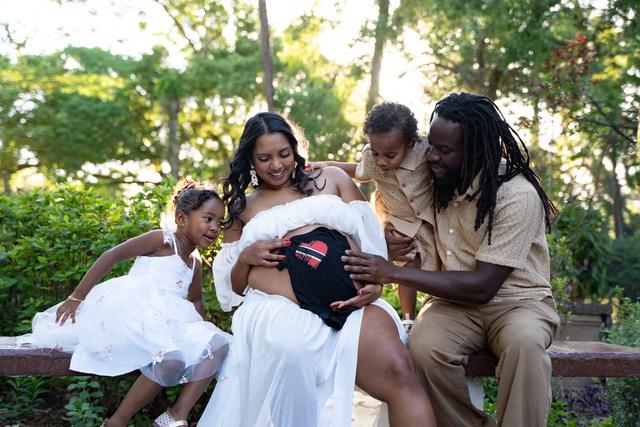 Family portrait outdoors under Spanish moss trees